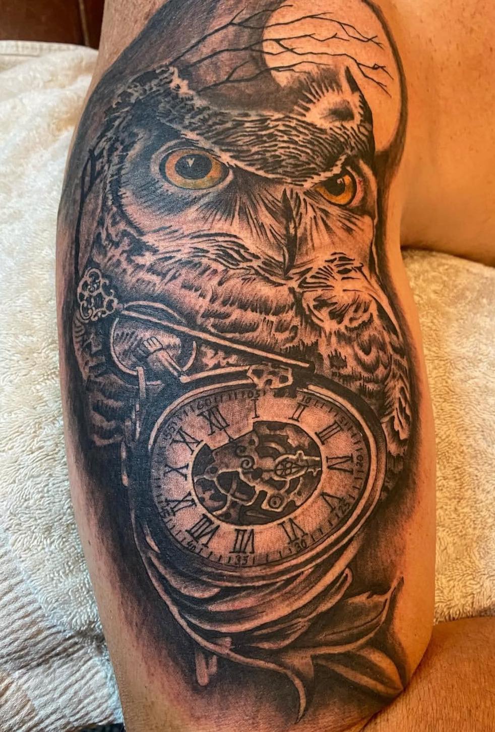 Owl and pocket watch arm tattoo
