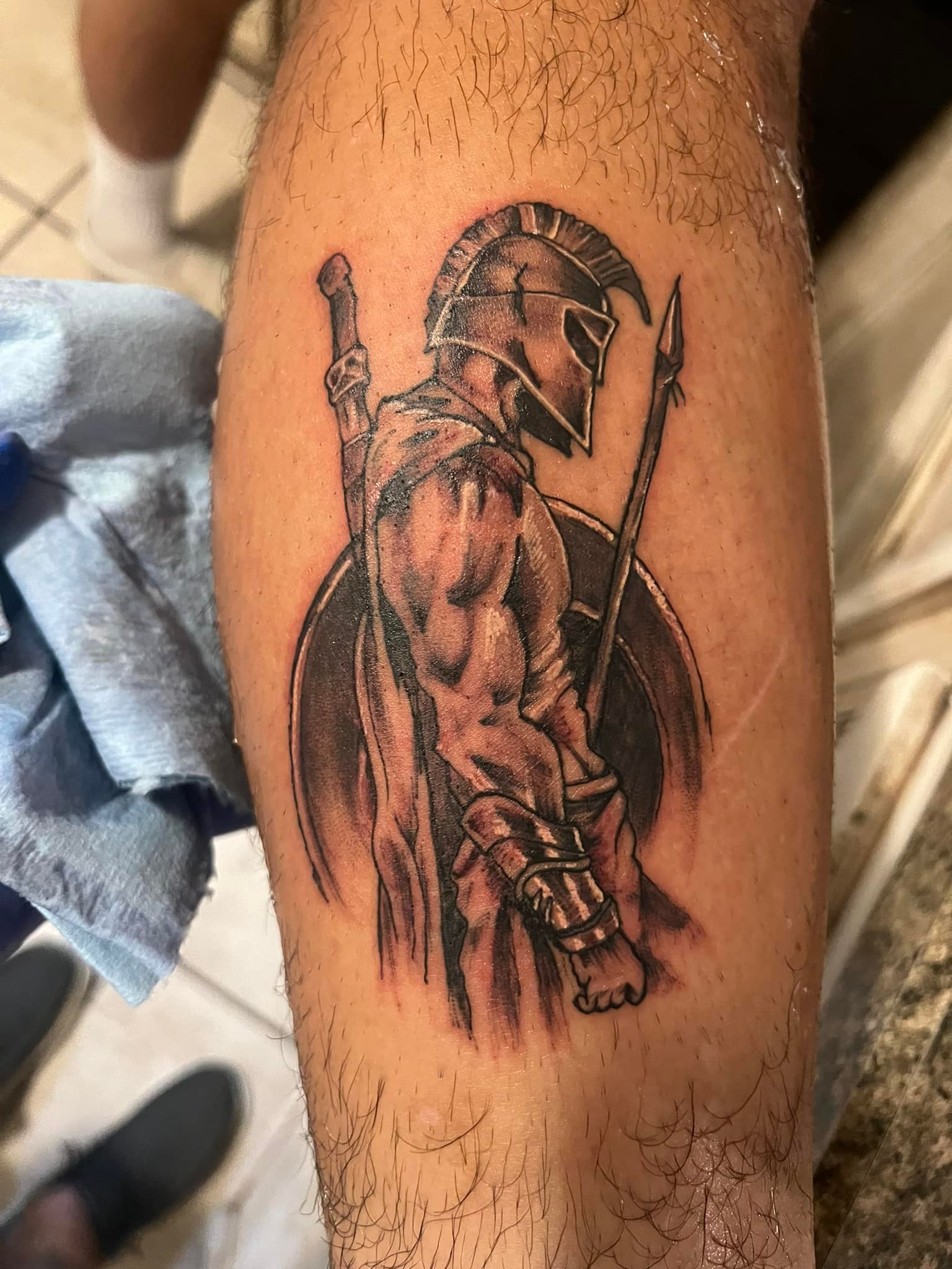 Spartan warrior calf tattoo